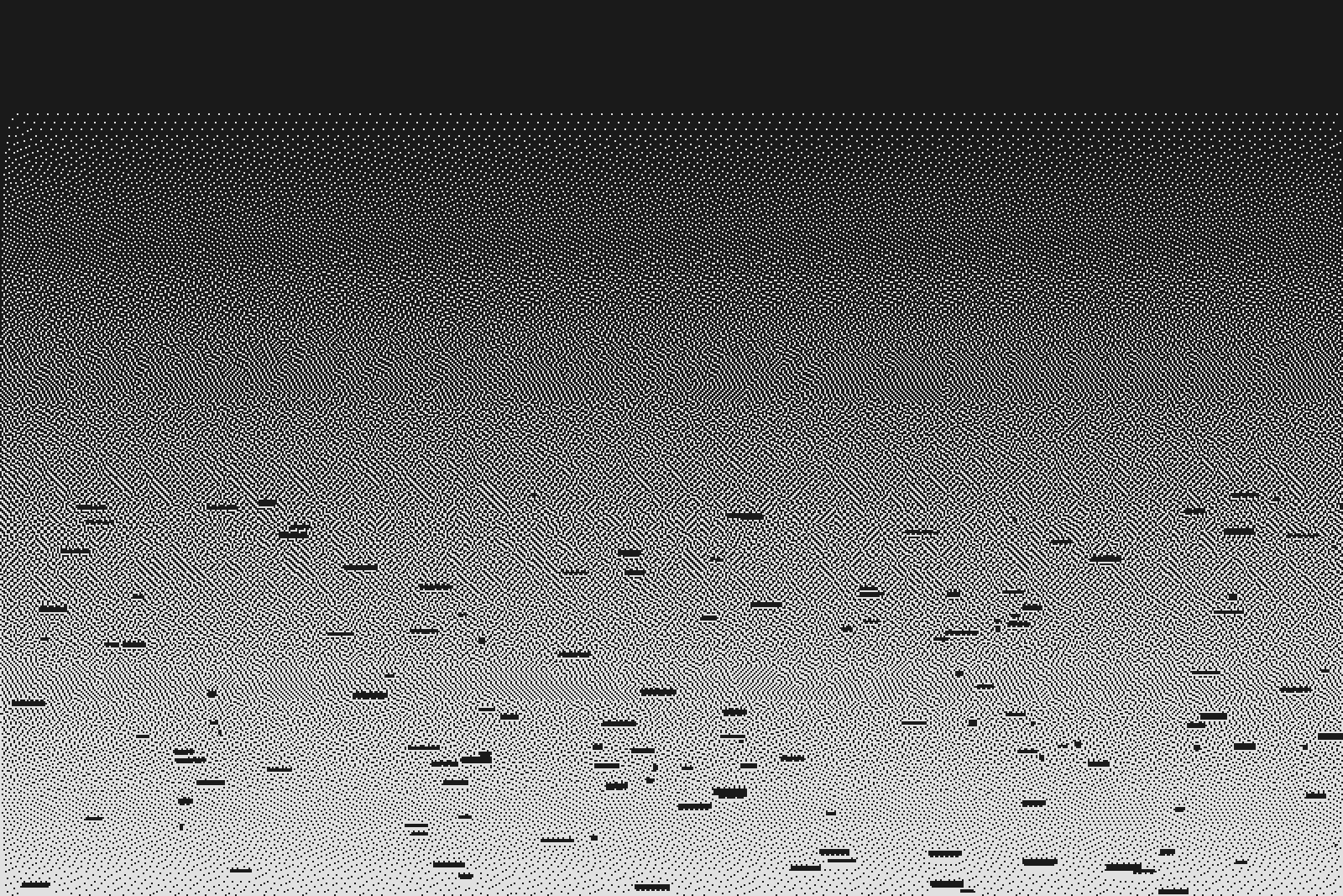 Long low sky over rooftops, warm at the horizon.